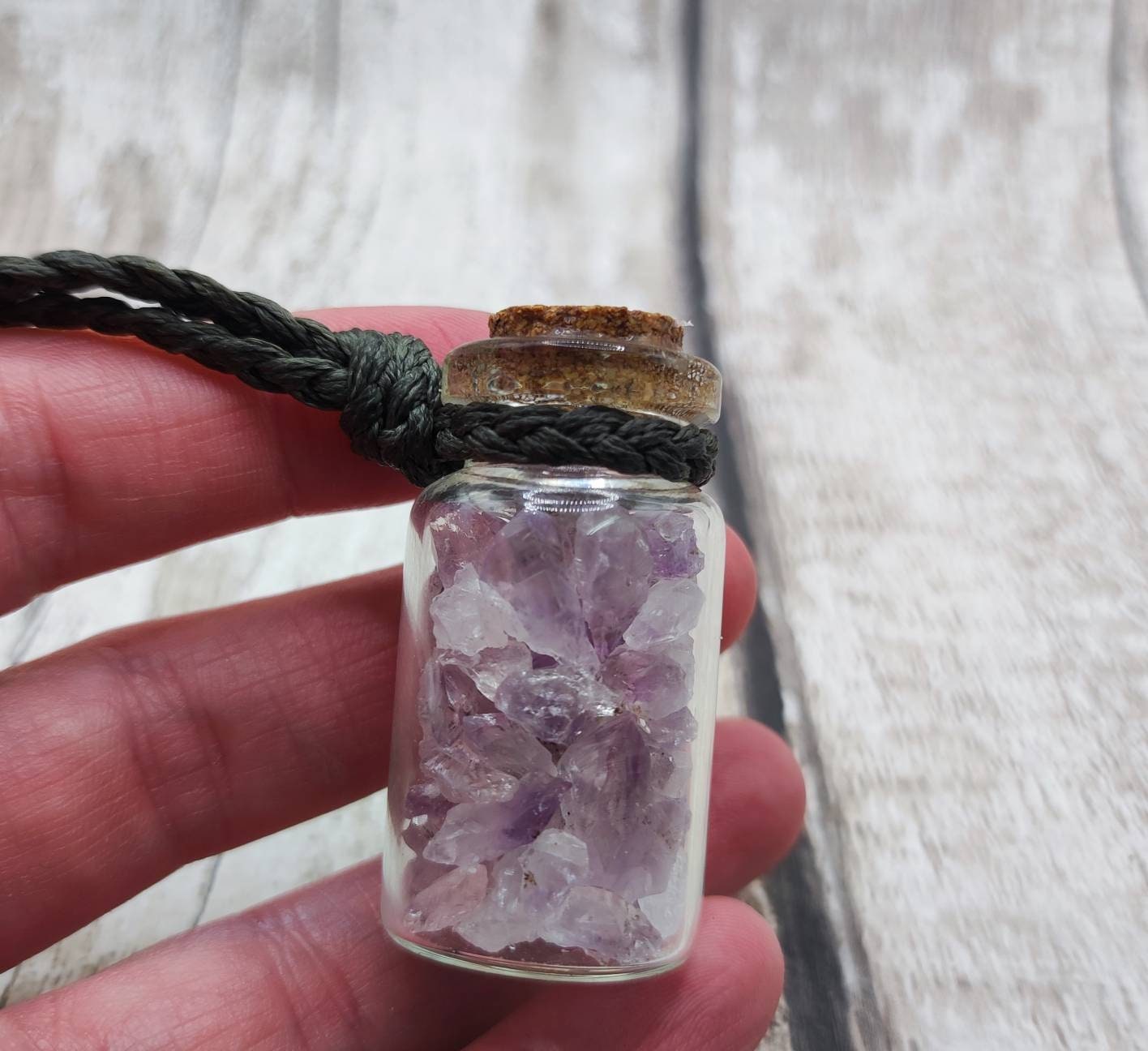 Amethyst semi precious stone cluster glass bottle pendant.