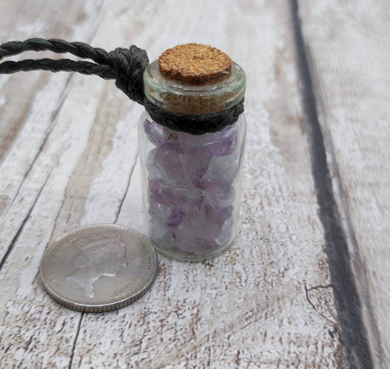 Amethyst semi precious stone cluster glass bottle pendant.