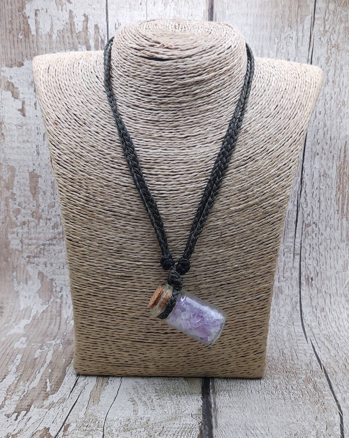 Amethyst semi precious stone cluster glass bottle pendant.