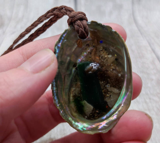 New Zealand pounamu greenstone in epoxy resin and paua shell, sea scale pendant.