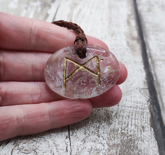 Clear quartz crystal mannaz rune stone pendant.