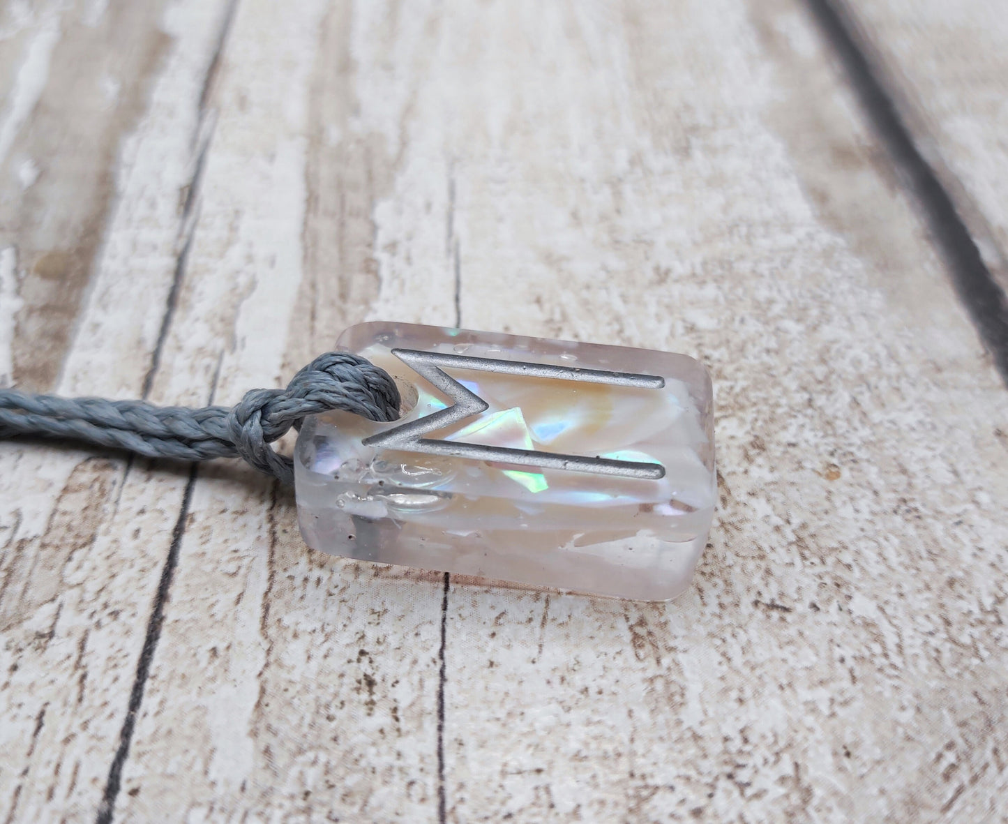 Ehwaz rune pendant in UV resin and mussel shell.