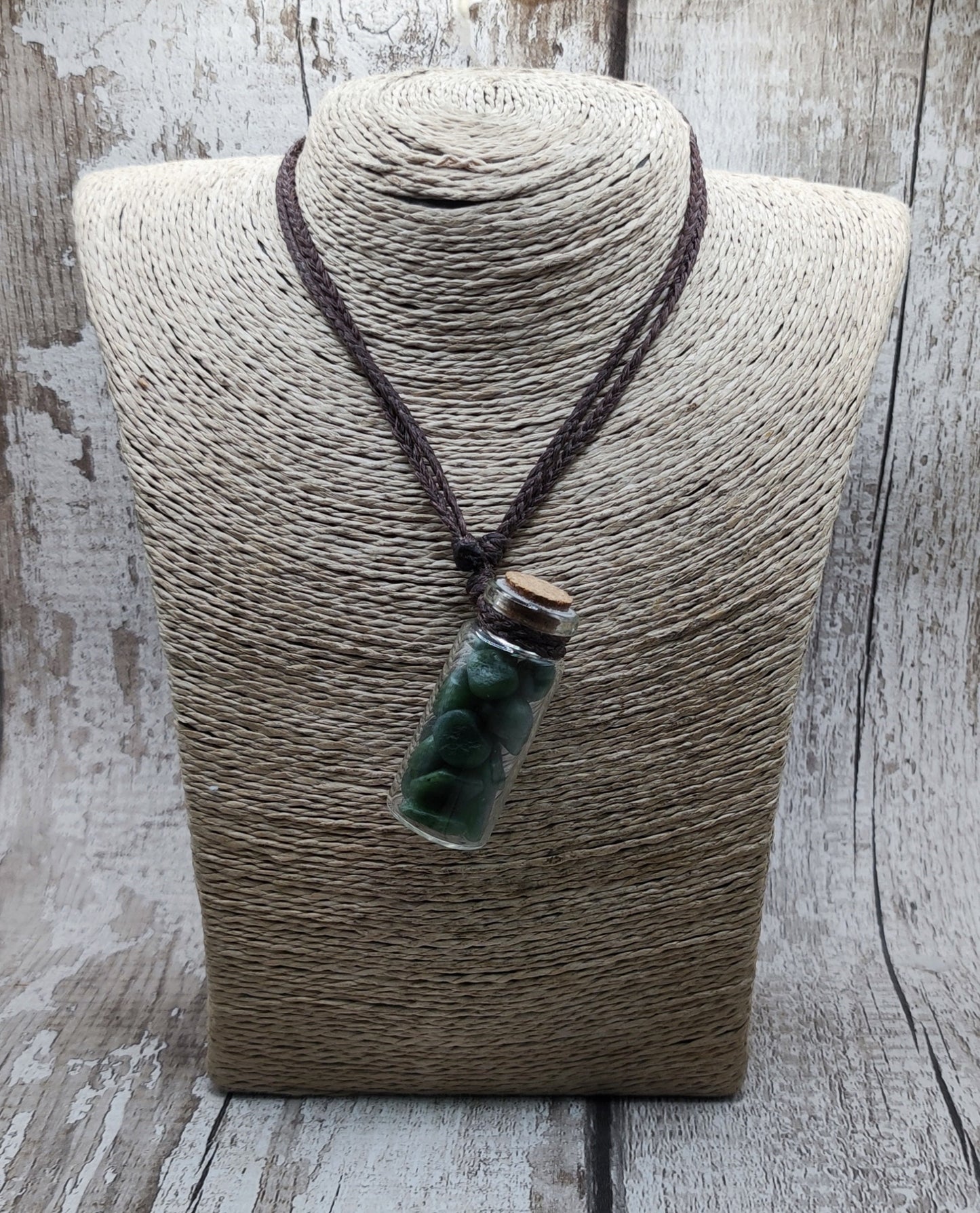 Nephrite jade chips in bottle pendant.