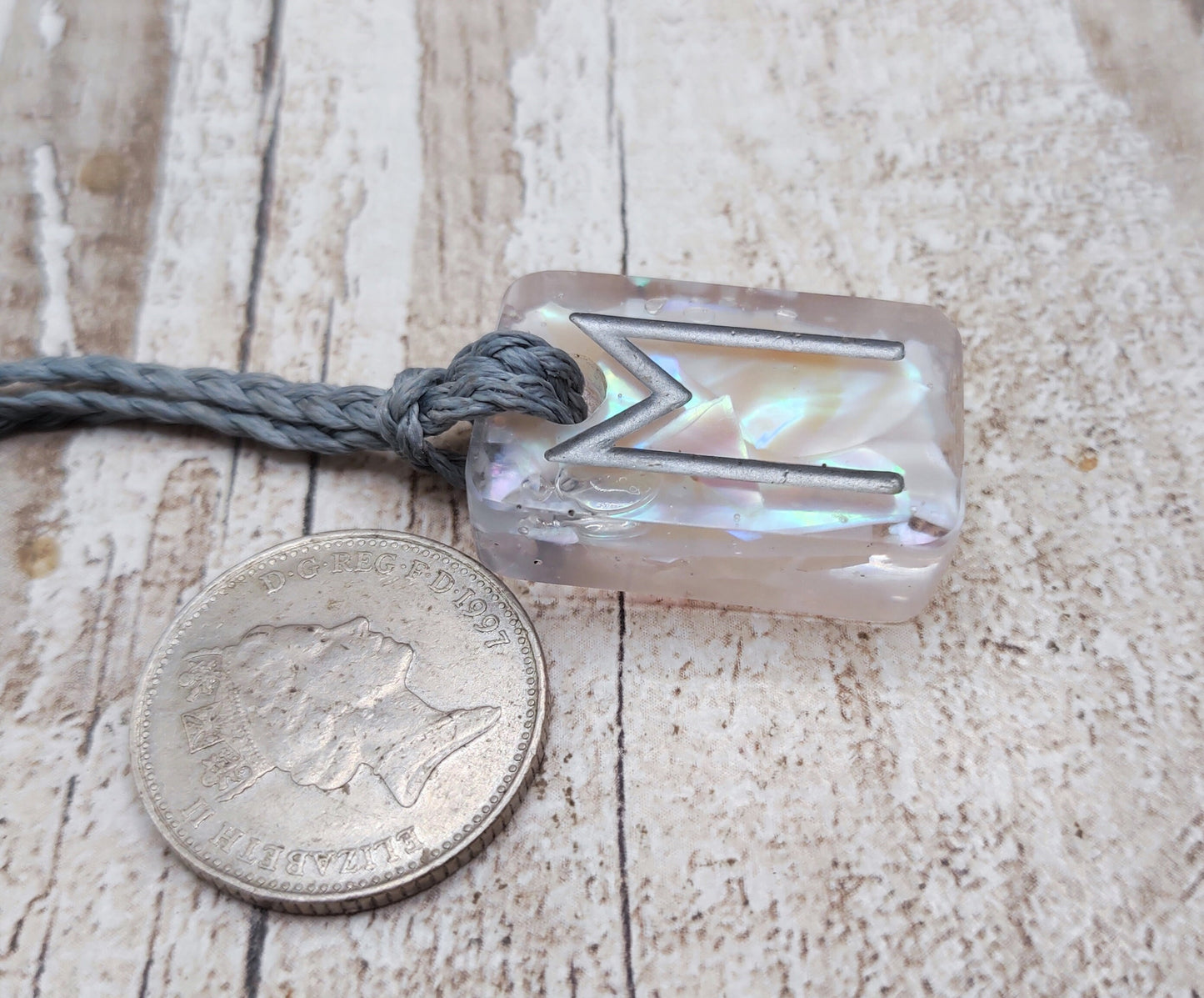 Ehwaz rune pendant in UV resin and mussel shell.