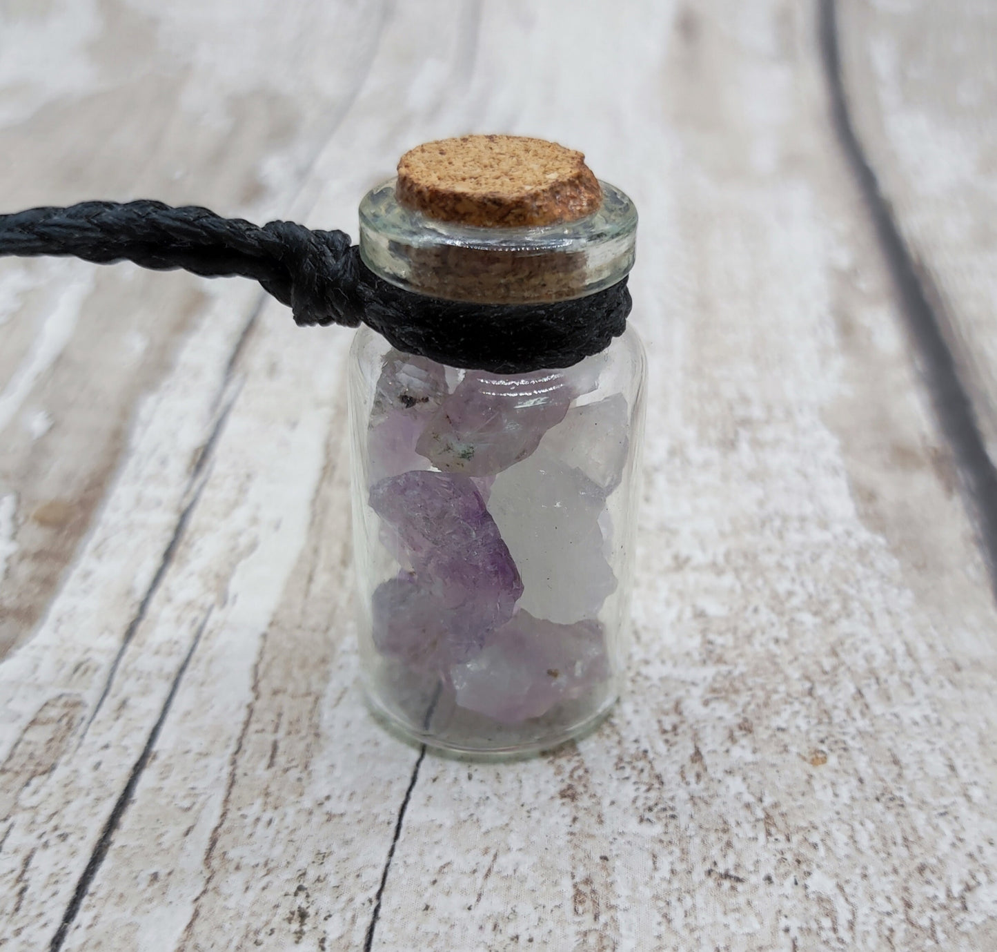 Amethyst in glass bottle unisex pendant.