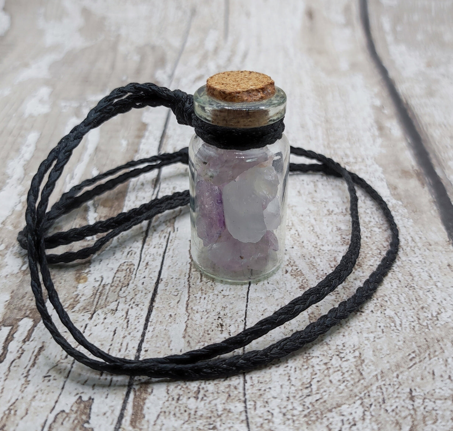 Amethyst in glass bottle unisex pendant.