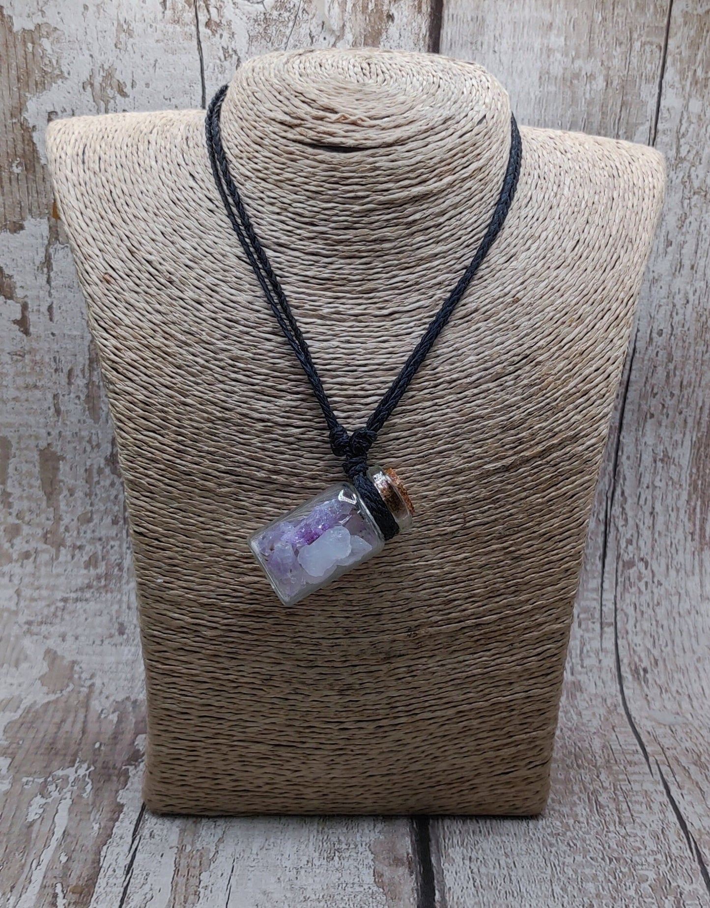 Amethyst in glass bottle unisex pendant.