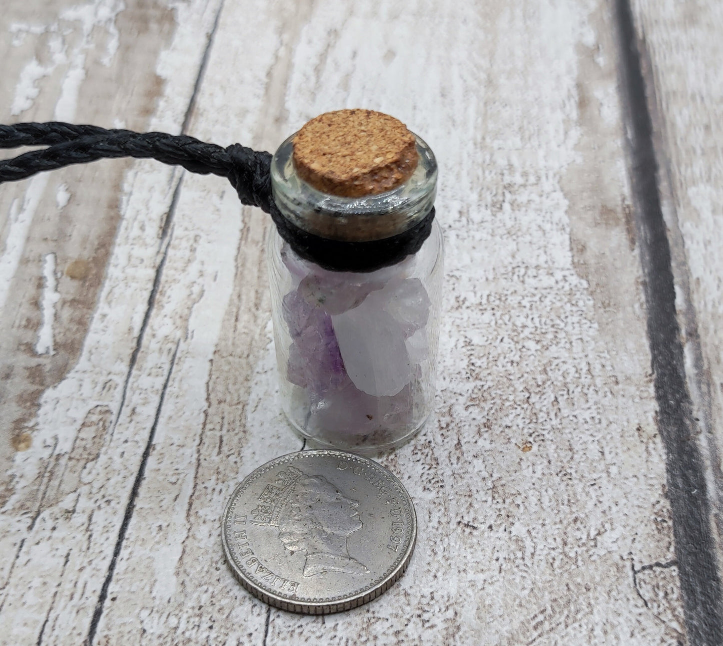 Amethyst in glass bottle unisex pendant.