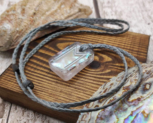 Ehwaz rune pendant in UV resin and mussel shell.