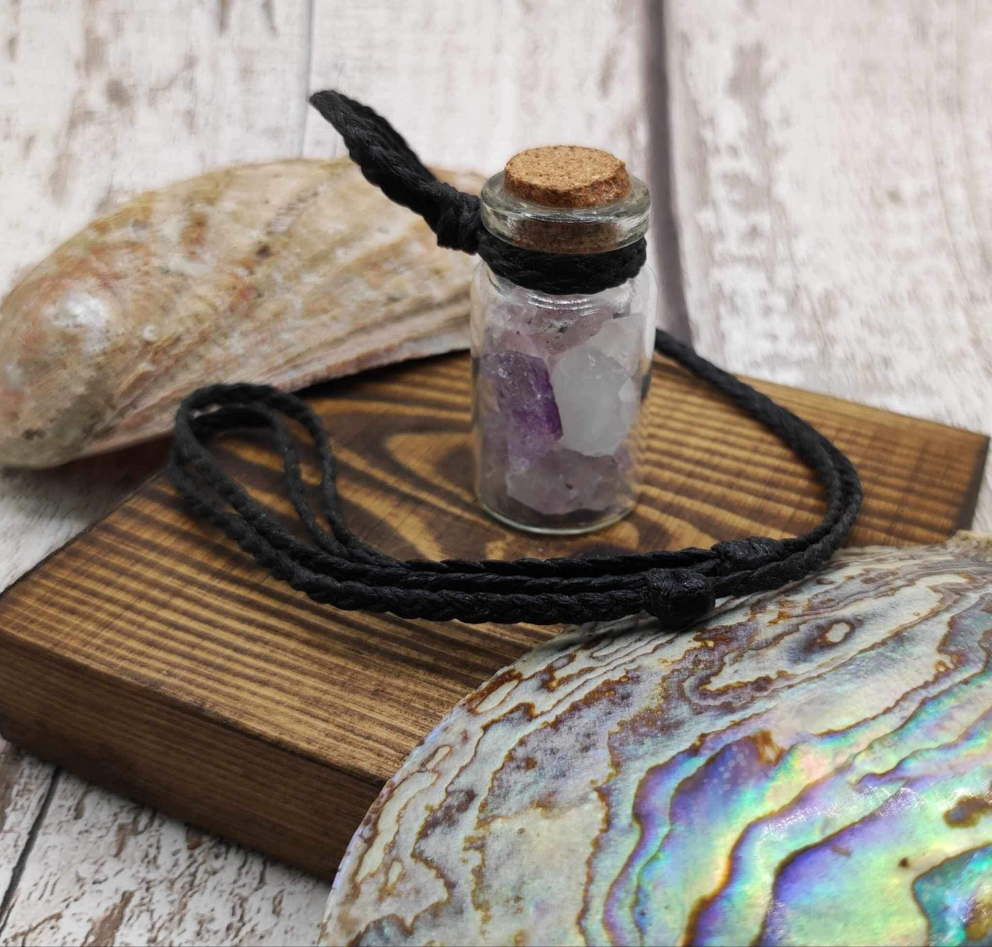 Amethyst in glass bottle unisex pendant.