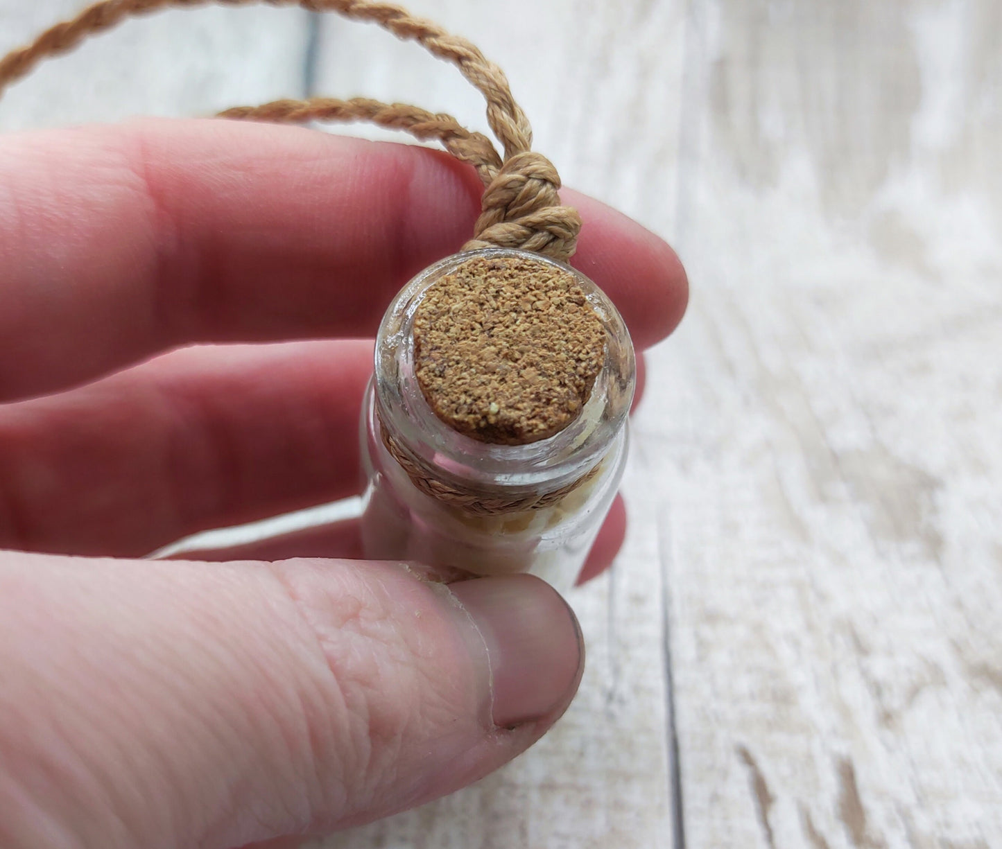 White shell filled bottle pendant.