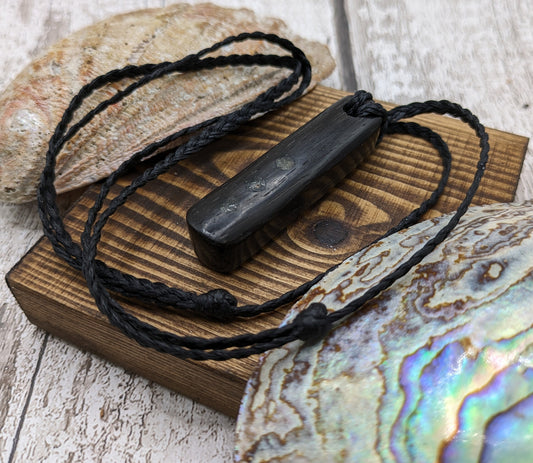 Bog oak wood and moldavite roimata pendant.