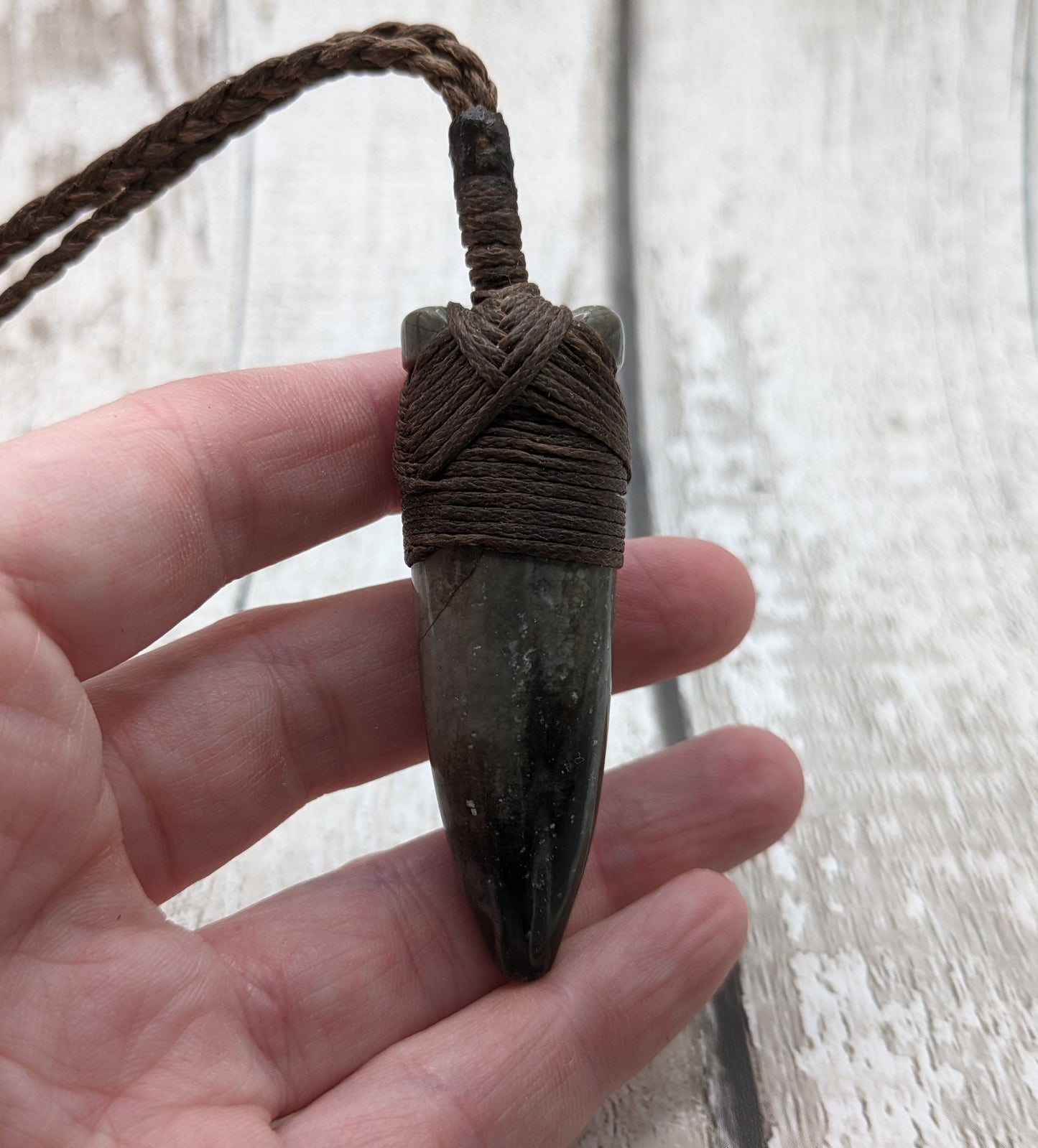 Belemnite fossil hei toki adze pendant.