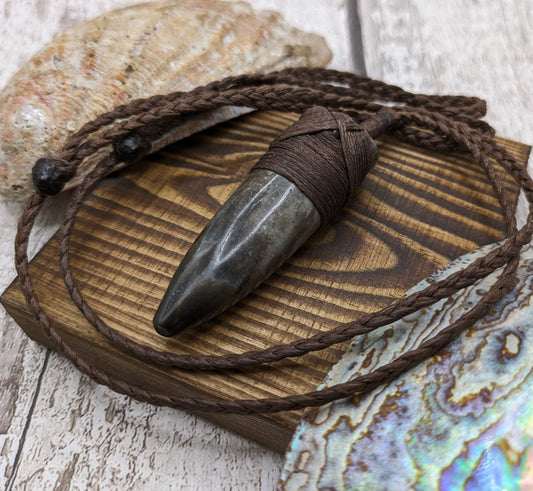 Belemnite fossil hei toki adze pendant.