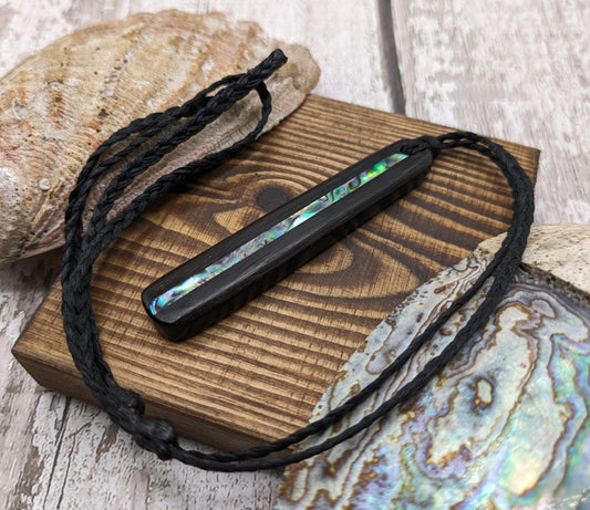 Fenland bog oak with New Zealand pāua shell inlay roimata pendant.