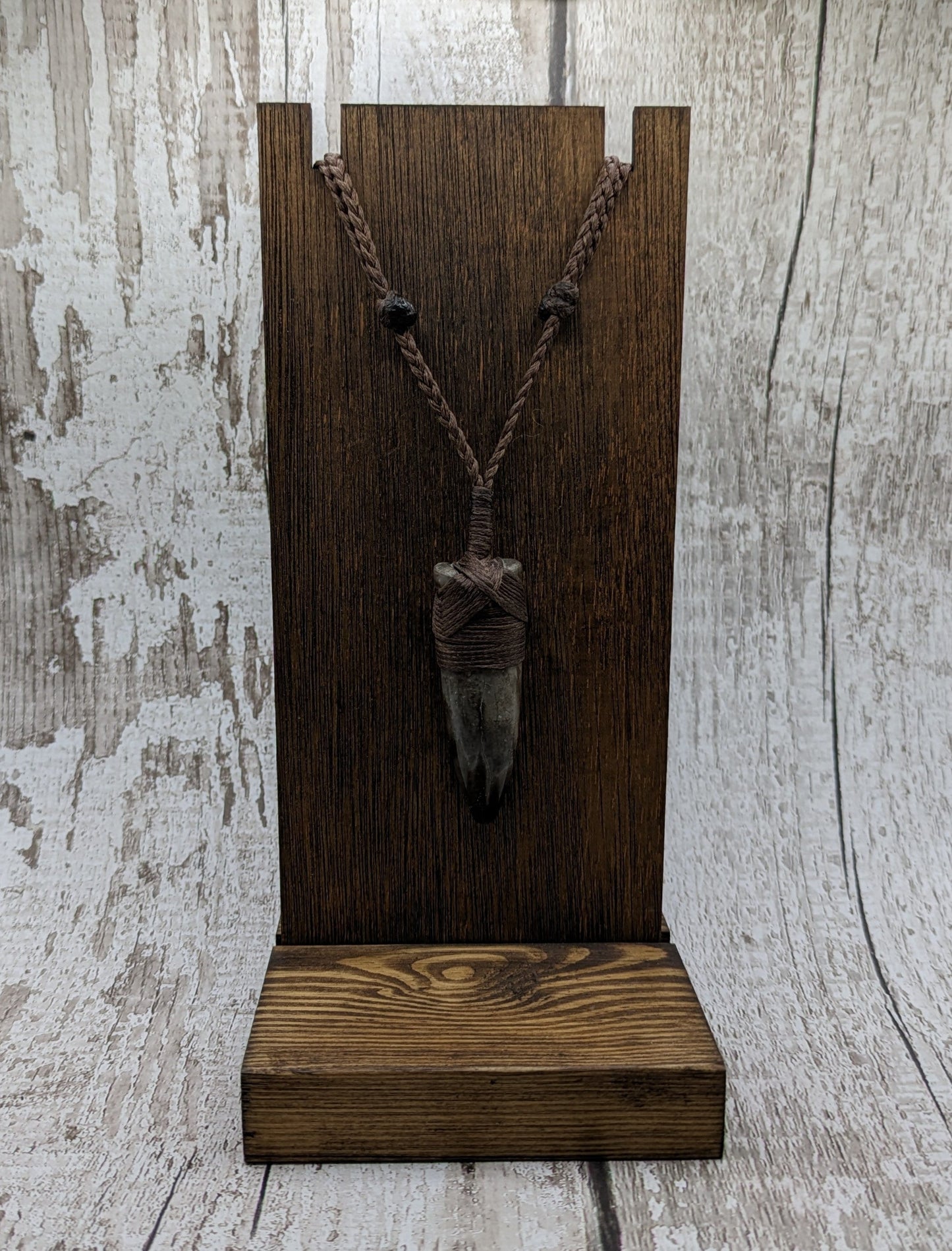 Belemnite fossil hei toki adze pendant.