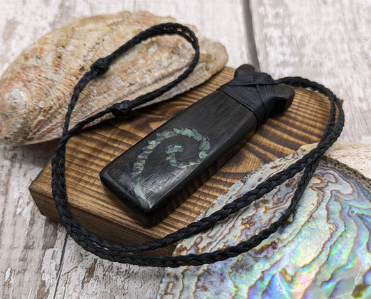 Fenland bog oak with pounamu greenstone toki pendant.